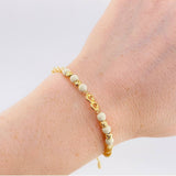 Pulsera Tejida Beige Herraje Infinito Bolas Diamantadas 4Mm / 4 Und Oro Amarillo 18K