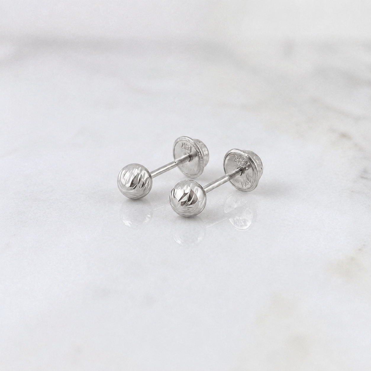 Topos Bola 0.55gr / Oro 18K &