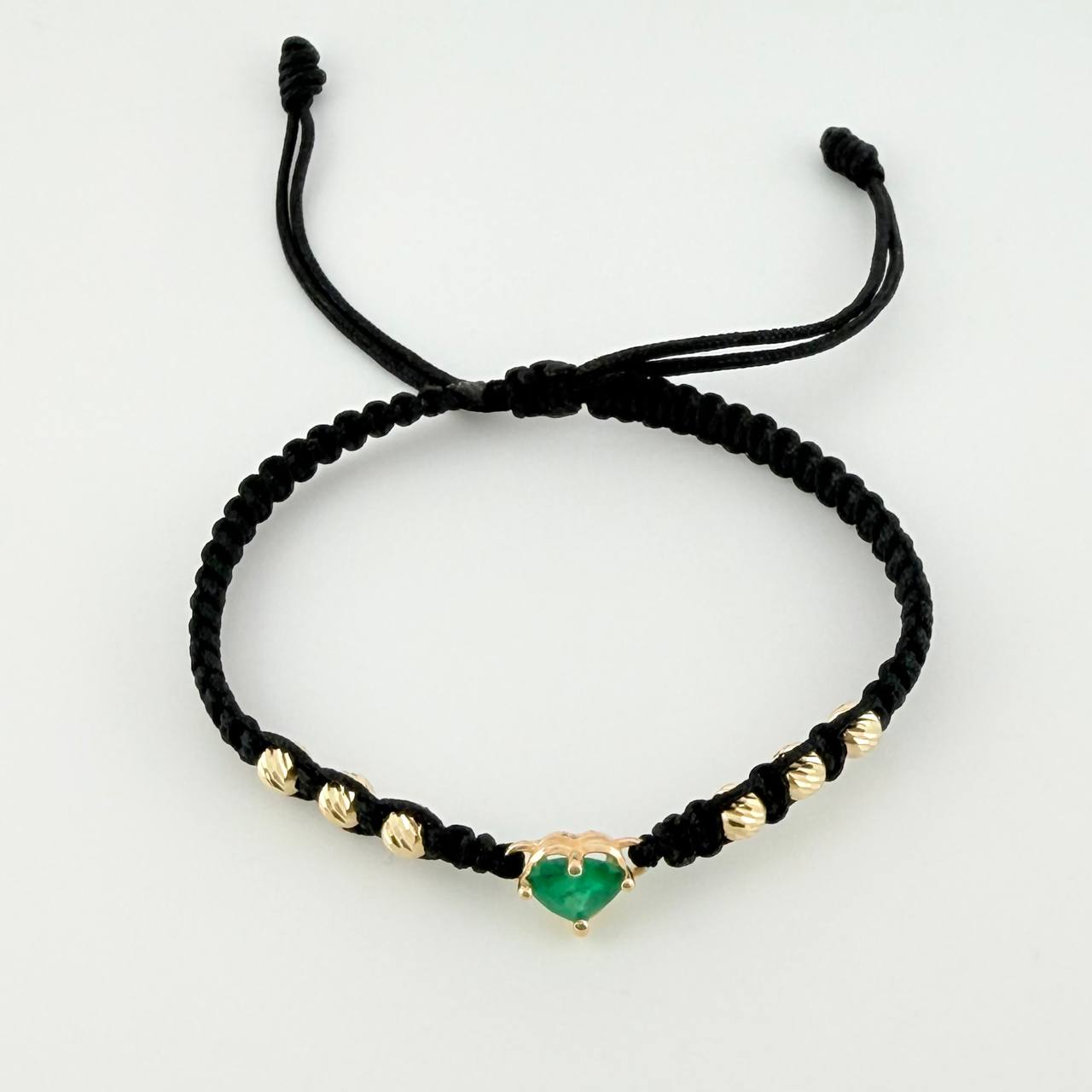 Pulsera Tejida Negra Bolas Diamantadas Corazón Esmeralda 60pts Oro Amarillo 18K