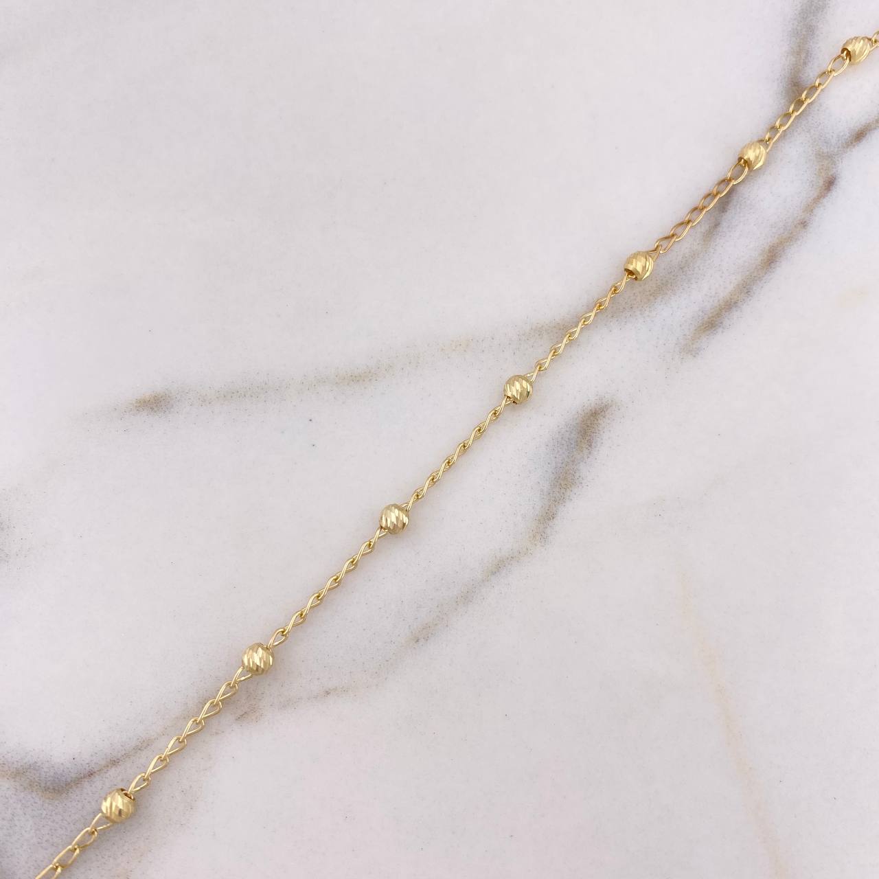 Tobillera Tipo Militar 2.25gr / 25cm / 2.8mm Bolas Diamantadas Oro Amarillo 18K $