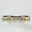 Pulsera Negra Herraje Corona 6.3gr / 5mm Cilindros Diamantados 11und Circones Blancos Dos Oros Amarillo Blanco 18K *