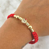 Pulsera Roja Herraje Emoji Lengua Afuera 1.9gr / 6mm Bolas Lisas 2und Cilindros Diamantados 4und Oro Amarillo 18K ©