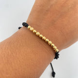 Pulsera Negra 1.2gr / 4mm Bolas Lisas Diamantada Oro Amarillo 18K (A.C)