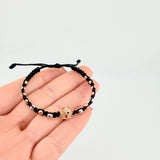 Pulsera Tejida Negra Herraje Fantasma / Bolas 6Und 3mm- 8Und 4mm Tres Oros 18K