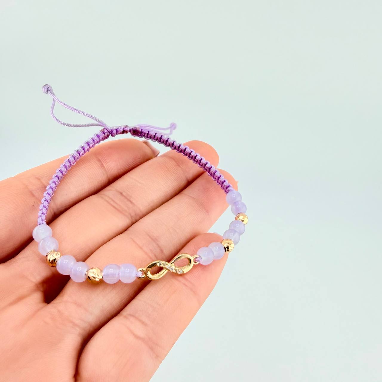 Pulsera Tejida Lila Dije Infinito Oro Amarillo 18K