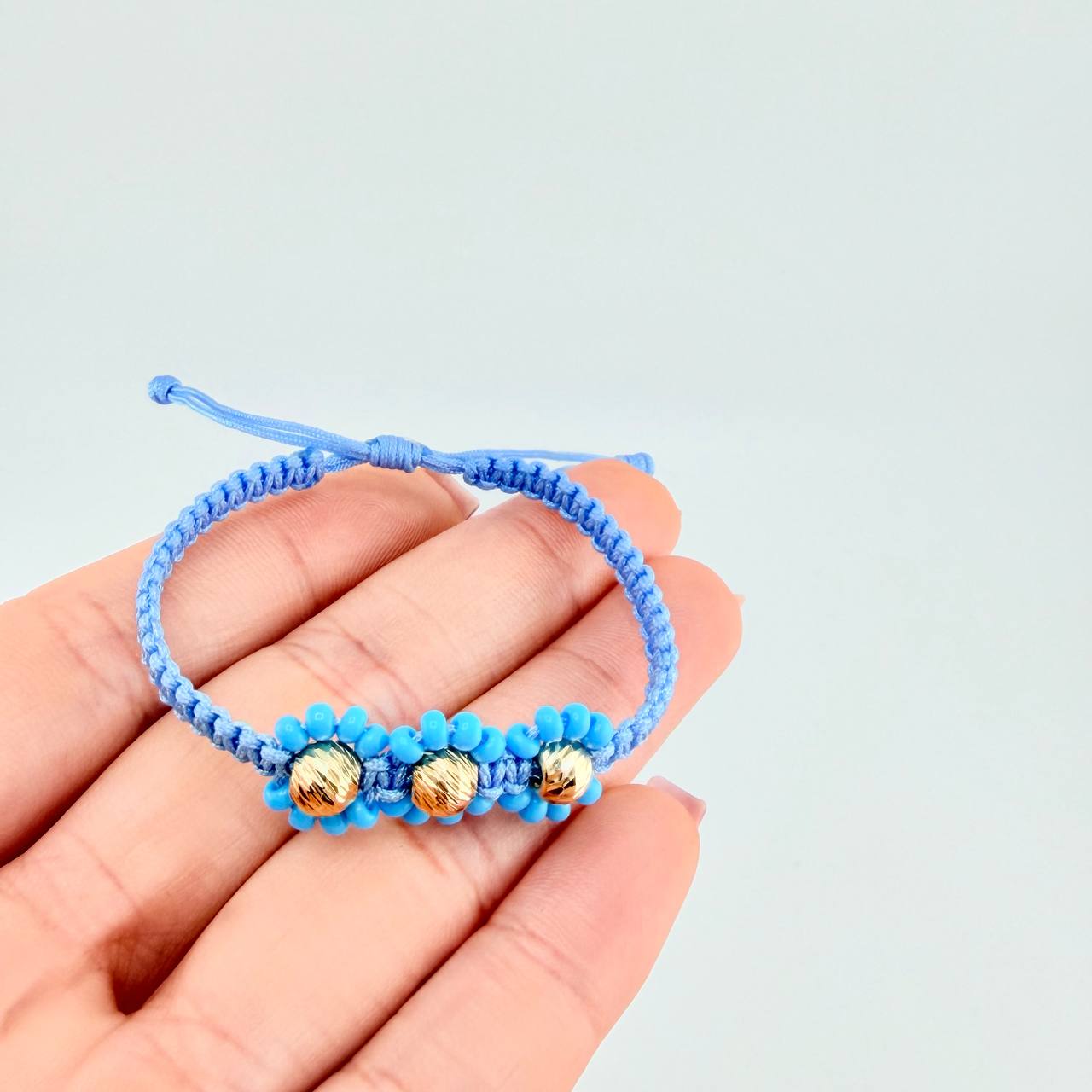 Pulsera Tejida Azul Trio Flores Oro Amarillo 18K