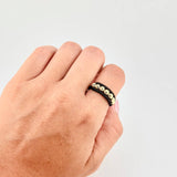 Anillo Tejido Negro Bolas Diamantadas 0.55 g / T7 Oro Amarillo 18K