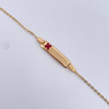 Pulso Bebe Aro Seguido 1.4gr / 13.9cm / Placa Rectangular Curva Trebol Rojo Oro Amarillo 18K &