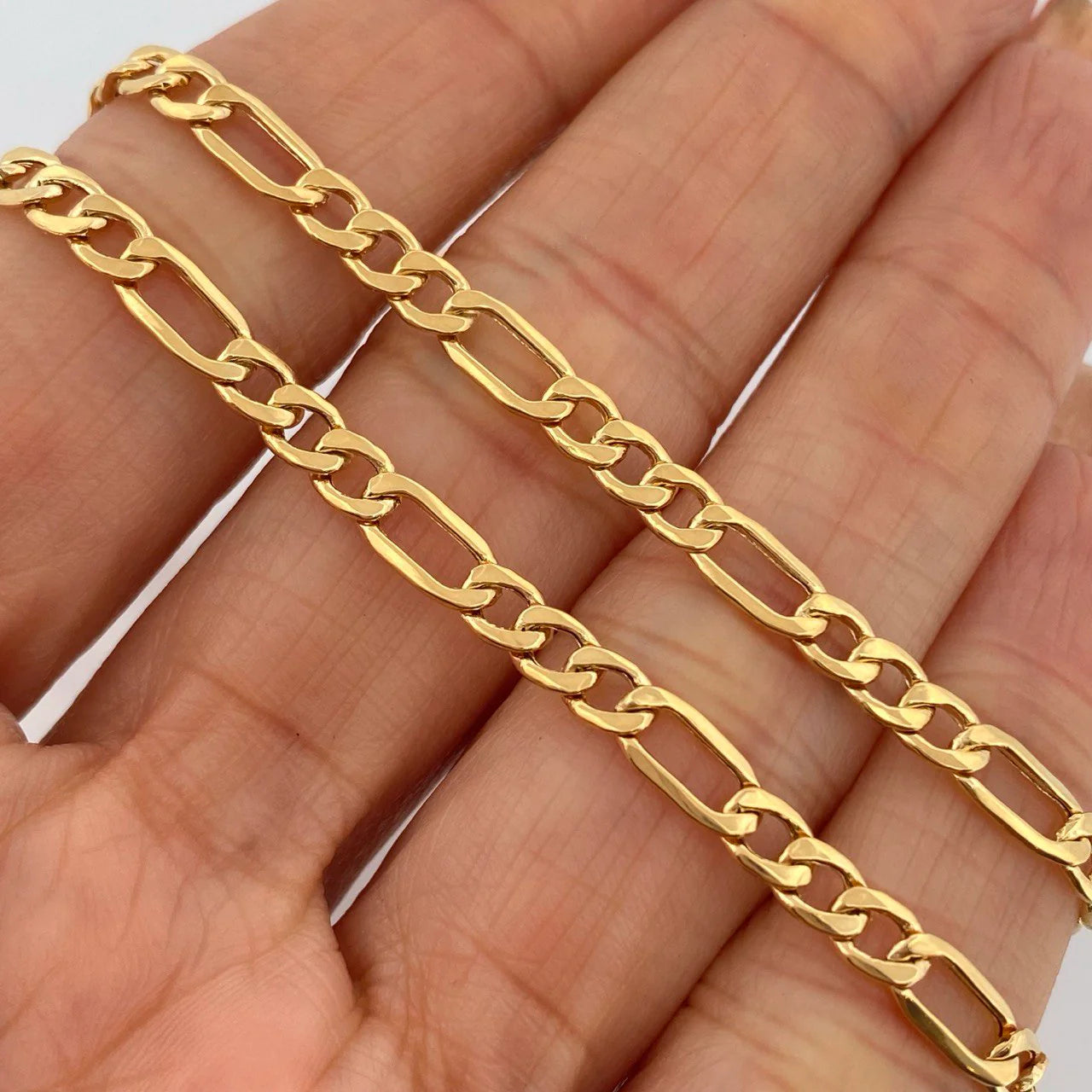 Cadena Figaro 8.95gr / 60.5cm / 4mm Oro Amarillo +1 18K $