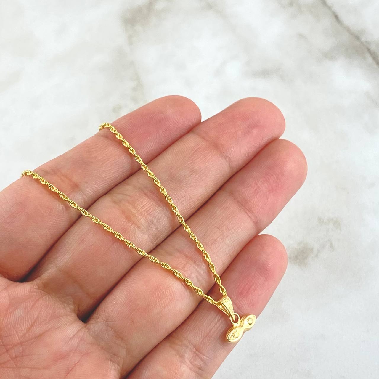 Set Cadena Lazo 1gr / 50cm / 1.2mm + Dije Ojos Santa Lucia 0.3gr / 1.1cm Mate 1.3gr Oro Amarillo 18K (Oferta)