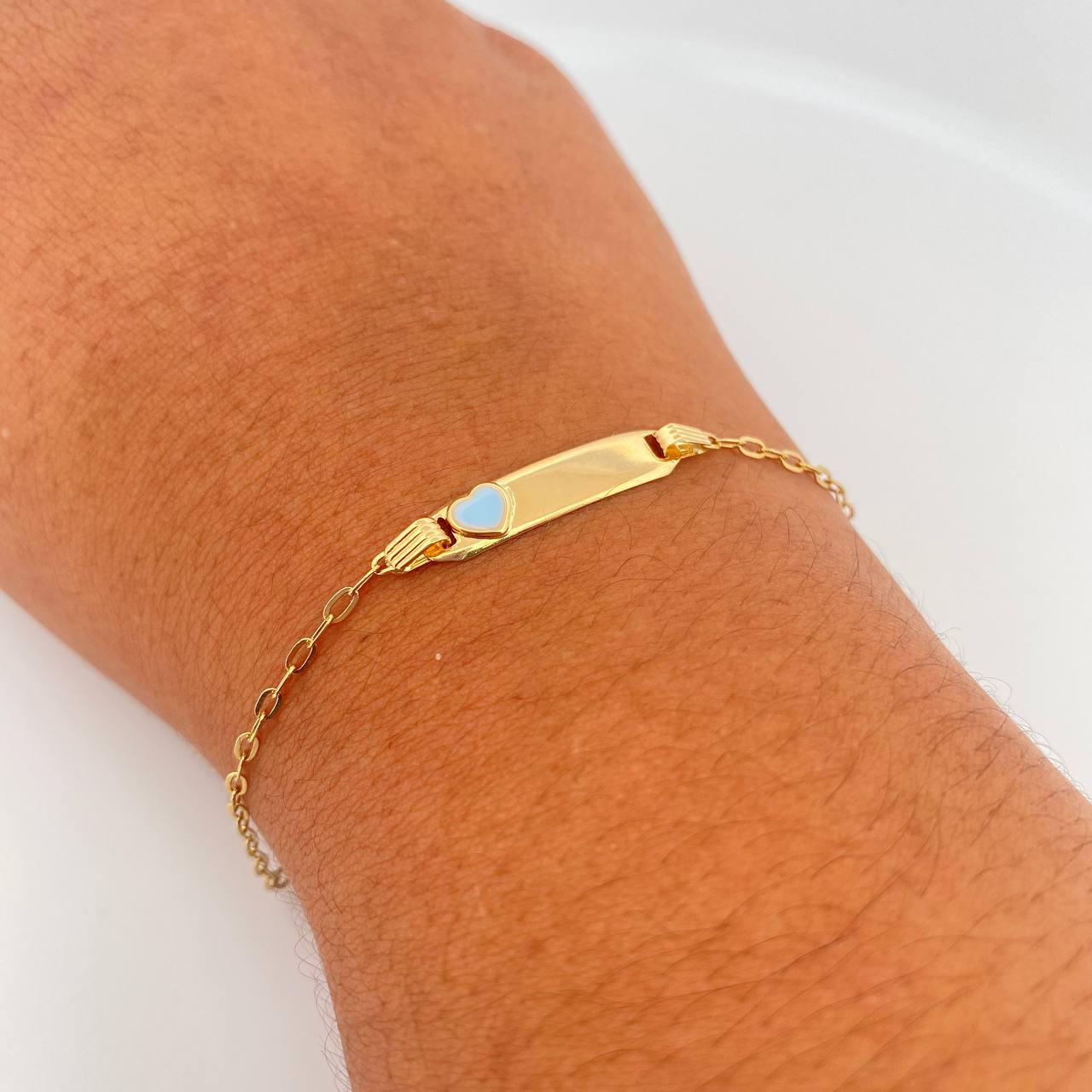 Pulso Bebé Cajon Corazon Celeste 1.45gr / 13.4cm-14.2cm / 1.5mm Placa Rectangular Curva Oro Amarillo 18K &