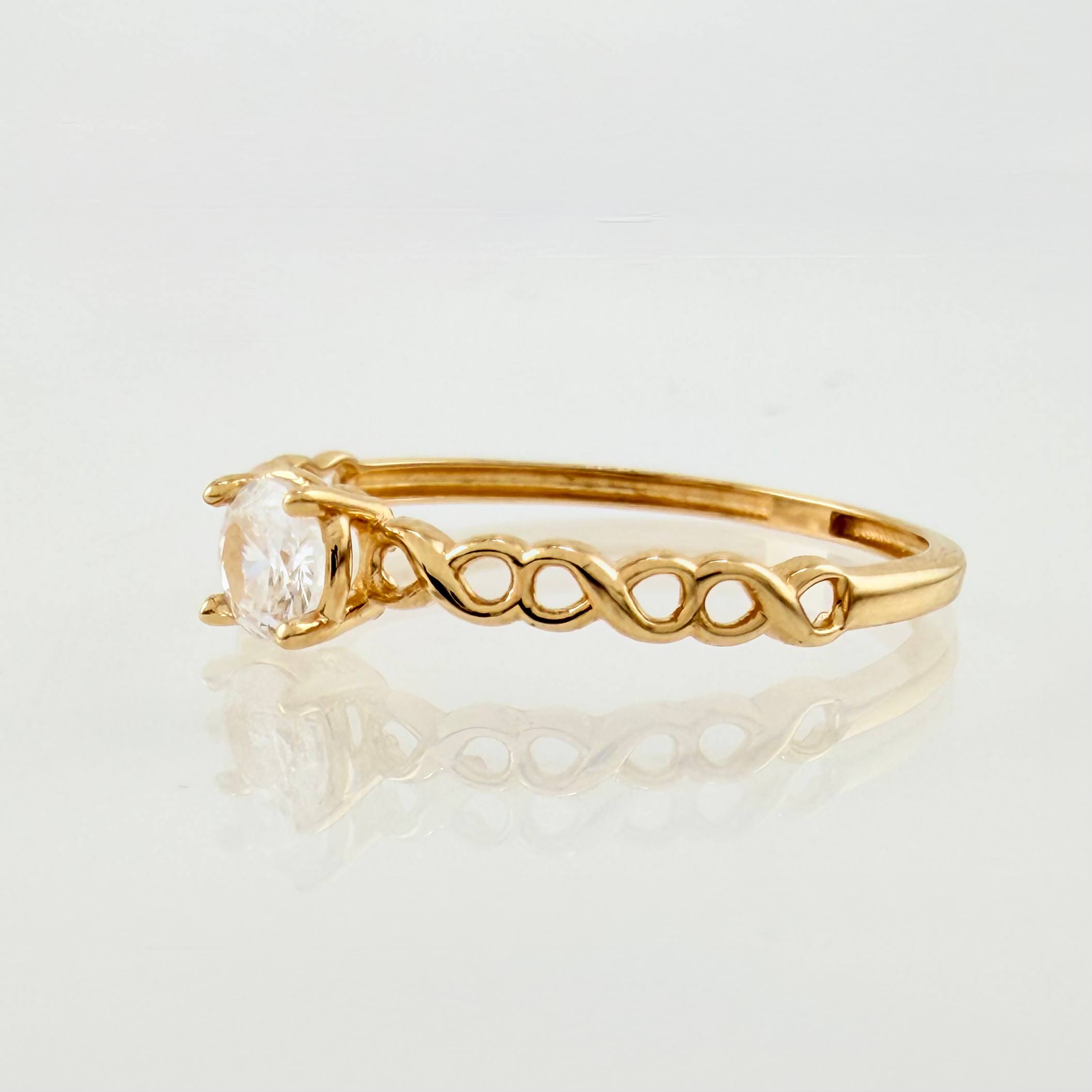 Anillo Solitario Infinitos 1.1gr / T6 1/2 / Oro Amarillo 18K ©