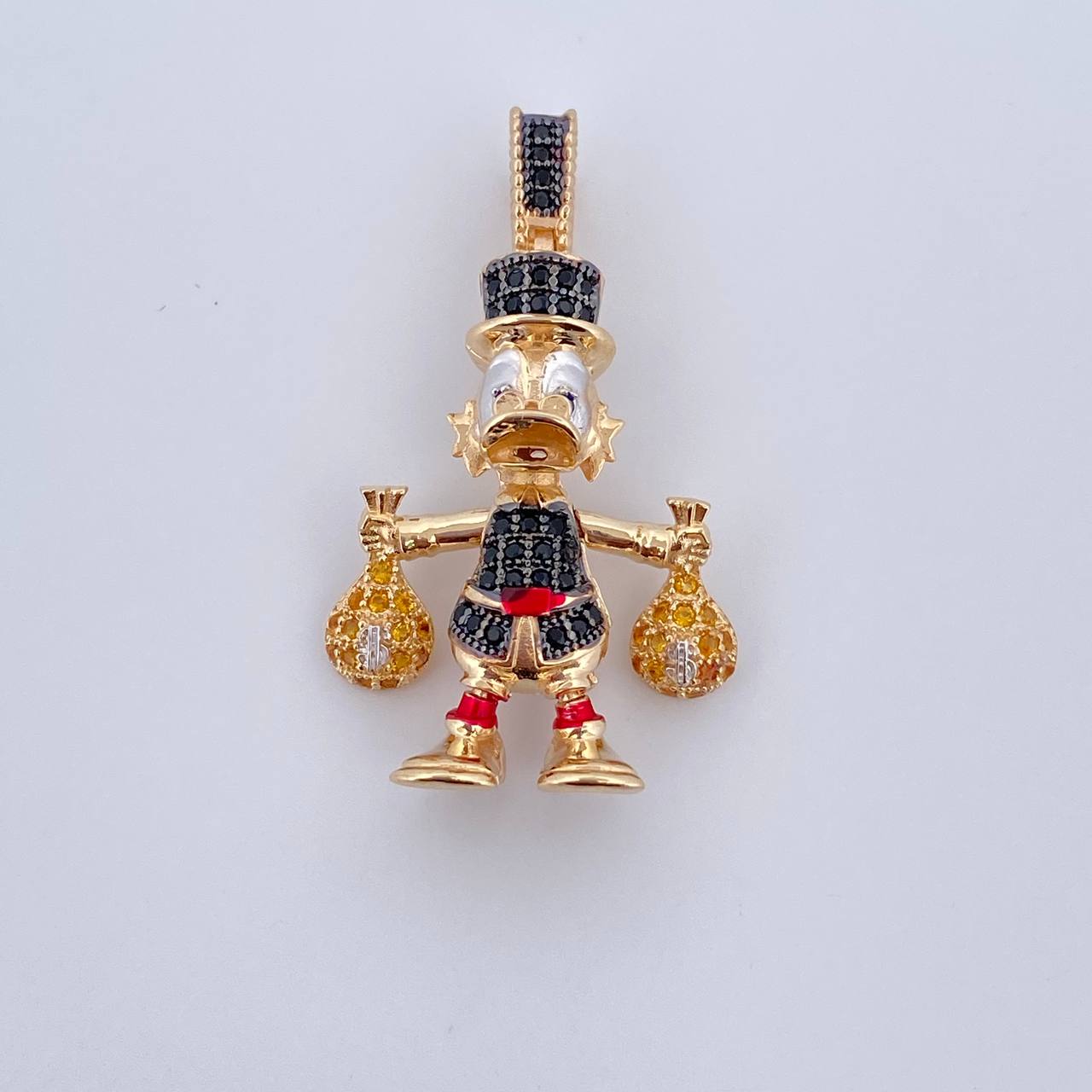 Dije Pato Bolsas Dinero 6.1gr / 3.4cm / Circones Azules Amarillos Negros Tres Oros 18K &