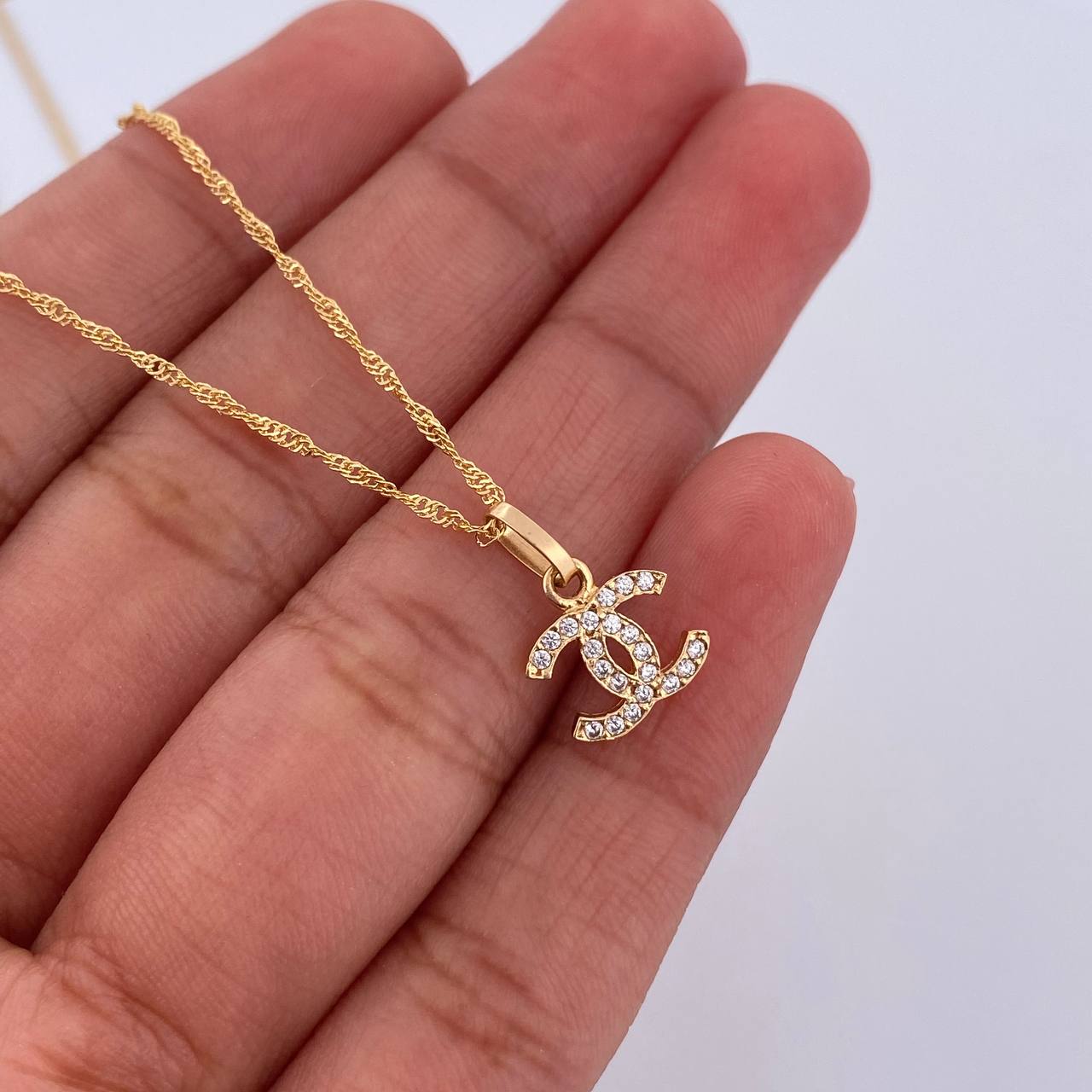 Set Cadena Singapur 1.35gr/44.6cm / 0.3 mm + Dije Ola Cruzada 0.55gr/1.3cm Circones Blancos Oro Amarillo 18K (Oferta) $