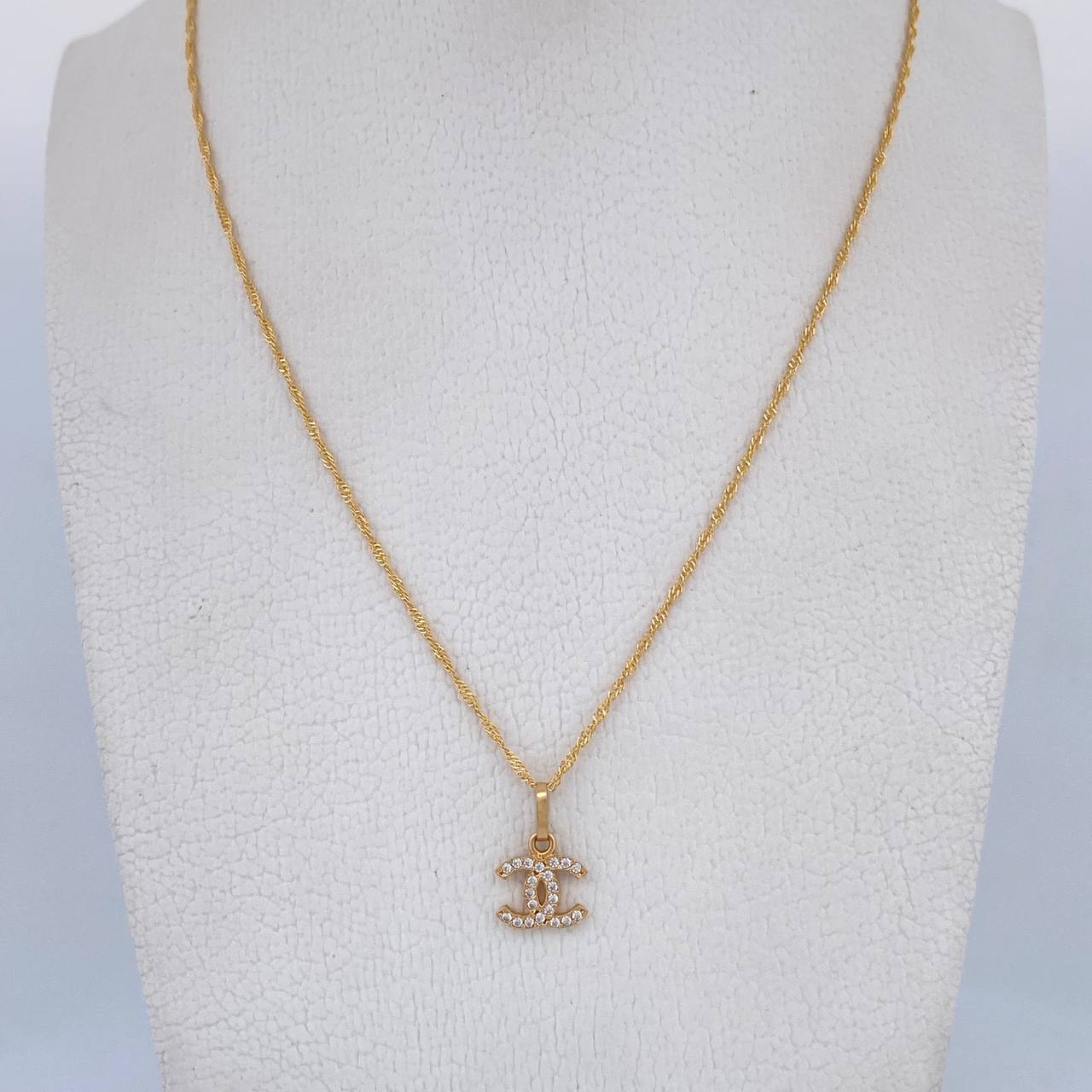 Set Cadena Singapur 1.35gr/44.6cm / 0.3 mm + Dije Ola Cruzada 0.55gr/1.3cm Circones Blancos Oro Amarillo 18K (Oferta) $