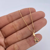 Set Cadena Veneciana 1.8gr / 45cm / 0.6mm + Dije Huella 0.55gr / 1.4cm Circones Negros Oro Amarillo 18K (Oferta) &