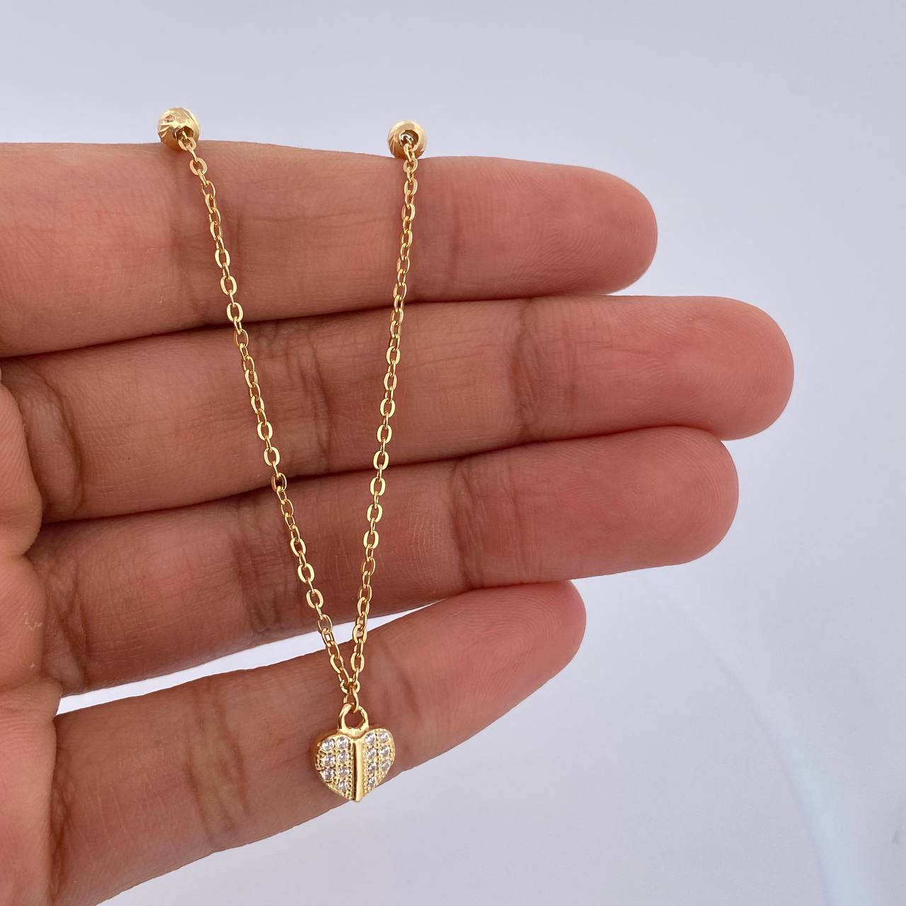 Tobillera Aro Seguido Corazon 2.2gr / 25.3cm / 4mm Bolas Diamantadas Circones Blancos Oro Amarillo 18K &