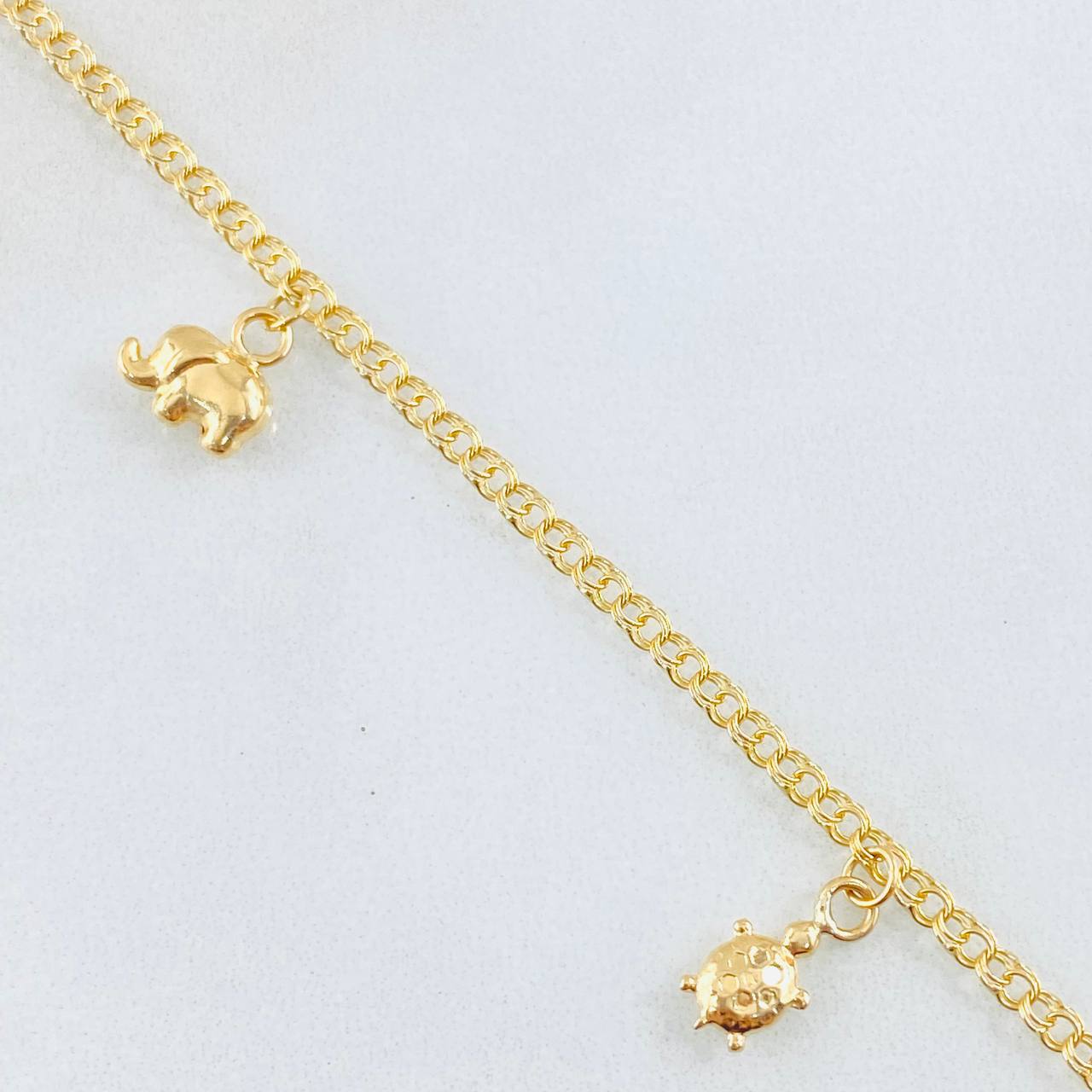 Tobillera Aro Seguido Dijes 3.8gr / 26cm / Oro Amarillo 18K *