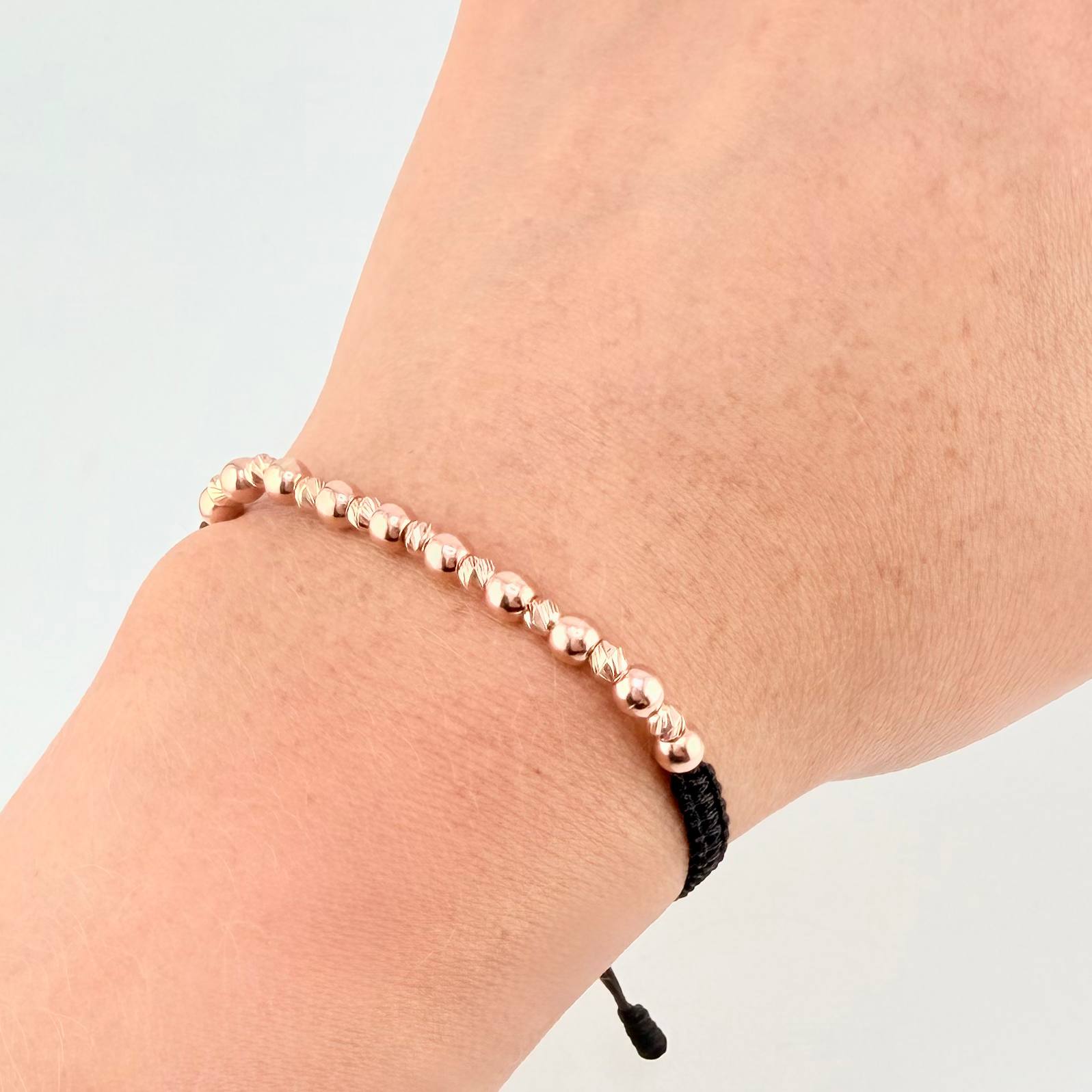 Pulsera Tejida Negra Bolas Lisas 10 Und- 4Mm / Diamantada 9 Und- 3Mm Oro Rosa 18K