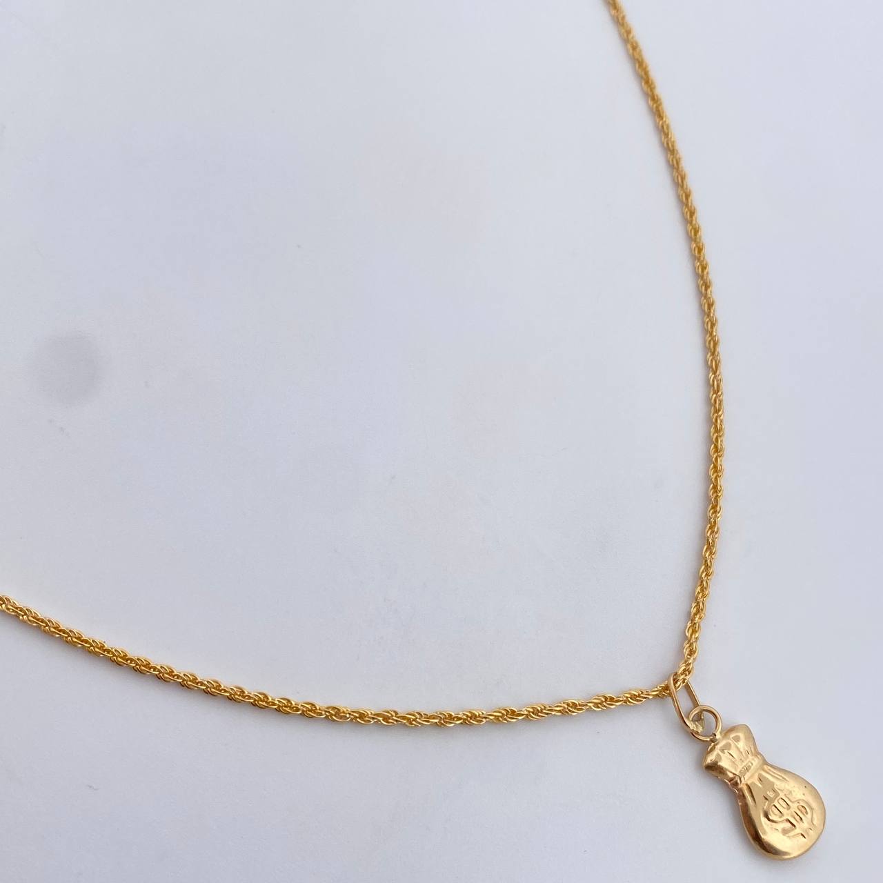 Set Cadena Lazo 1.15gr / 60cm / 1.2mm + Dije Bolsa Dinero 0.35gr / 1.7cm Oro Amarillo 18K (Oferta) &