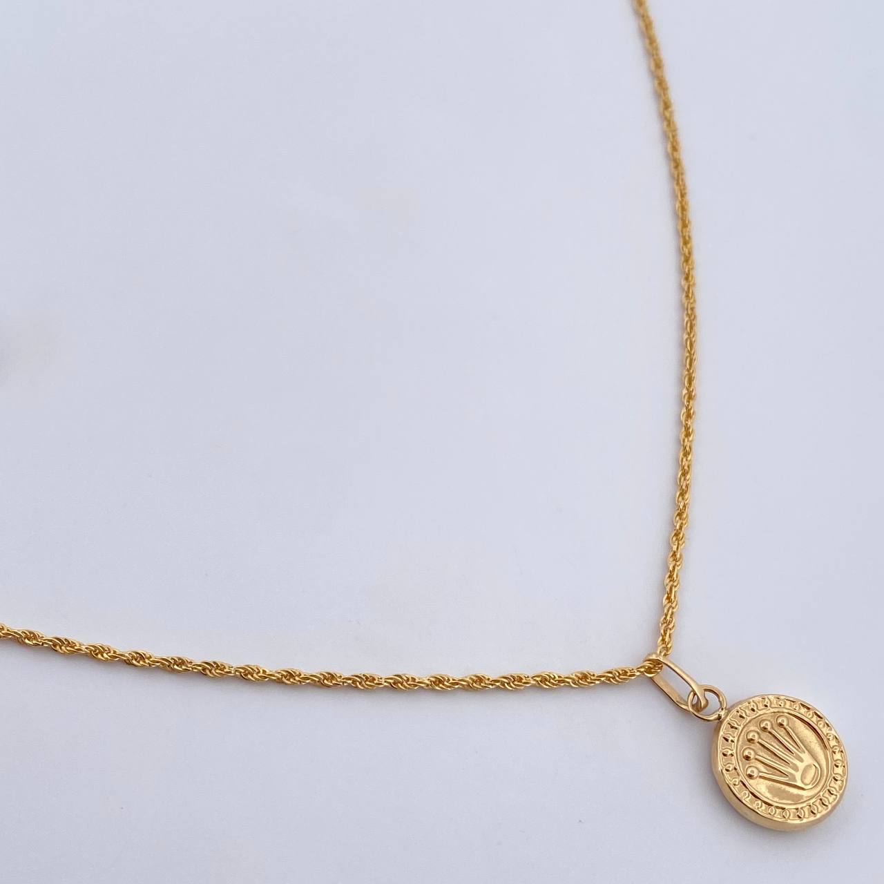 Set Cadena Lazo 1.15gr / 60cm / 1.2mm + Dije Corona RX 0.6gr / 1.8mc Troquelado  Oro Amarillo 18K (Oferta) &