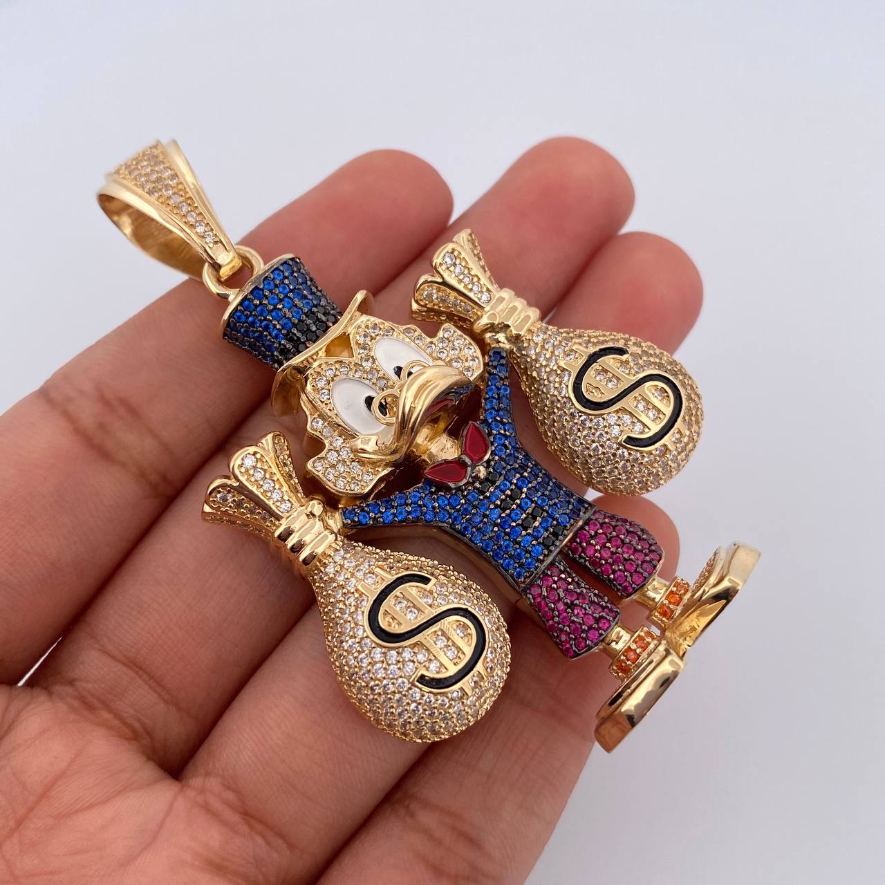 Dije Pato Bolsas Dinero 36.65gr / 6.6cm / Oro 18K $
