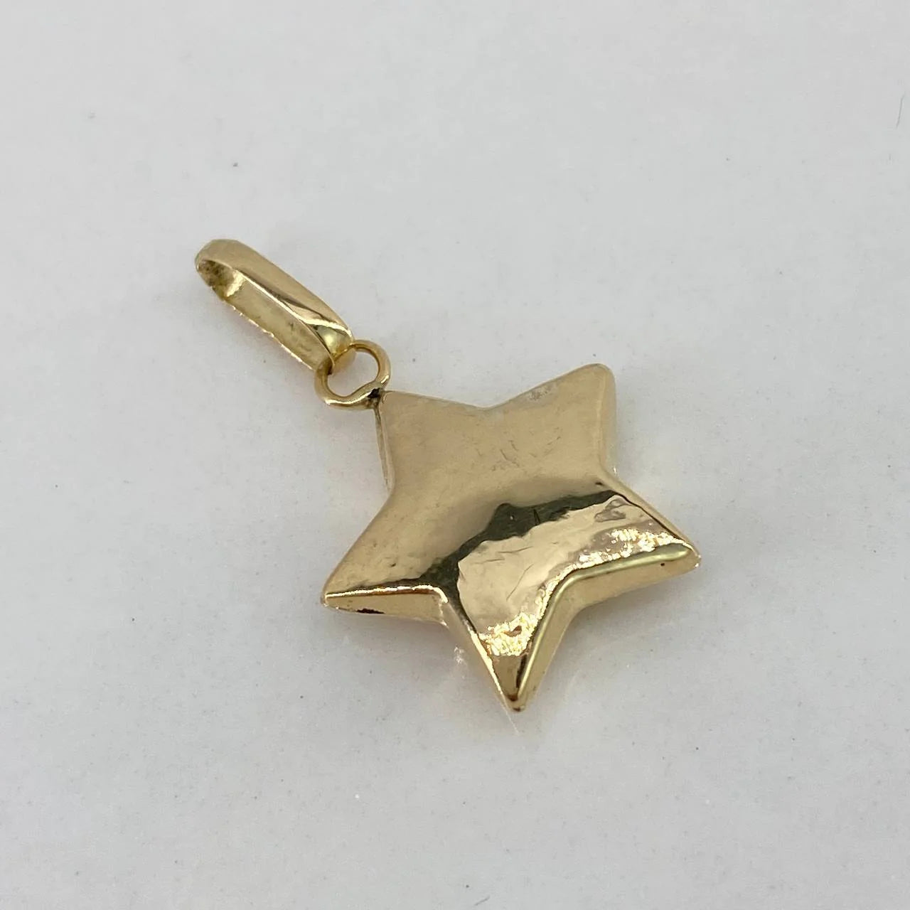 Dije Estrella 0.5gr / 1.9cm / Soplado Oro Amarillo $
