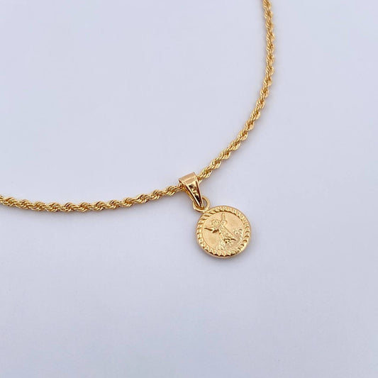 Set Cadena Lazo 2gr / 50.1cm / 1.4mm + Dije Divino Niño 0.5gr / 1.6cm Troquelado Oro Amarillo 18K (Oferta) $