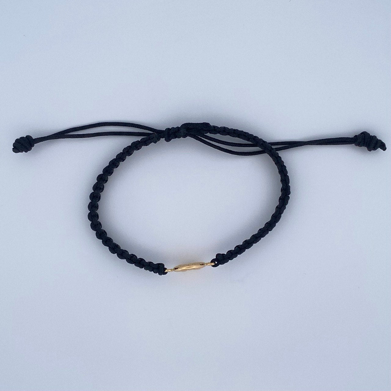 Pulsera Negra Sagrada Familia 0.6gr / Oro 18K &
