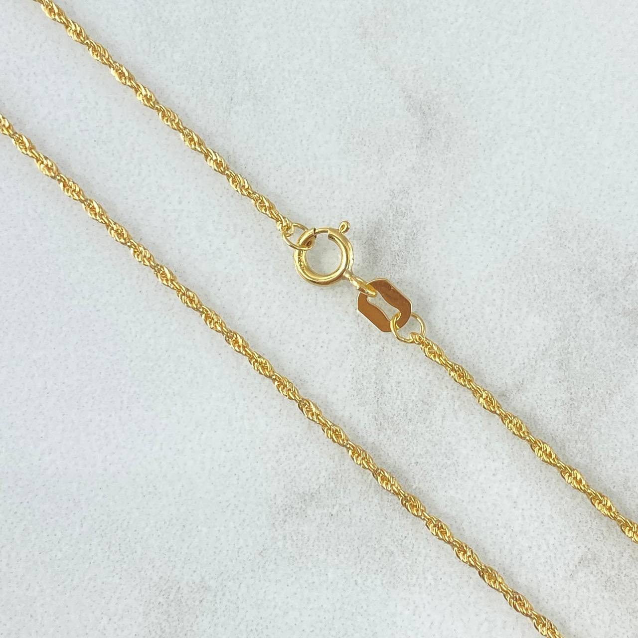 Set Cadena Lazo 1gr / 50cm / 1.2mm + Dije Cruz 0.25gr / 1.5cm Lisa 1.25gr Oro Amarillo 18K *