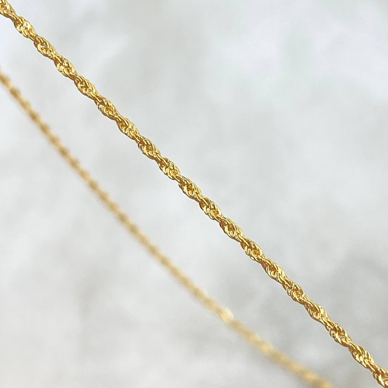 Set Cadena Lazo 1gr / 50cm / 1.2mm + Dije Cruz 0.25gr / 1.5cm Lisa 1.25gr Oro Amarillo 18K *