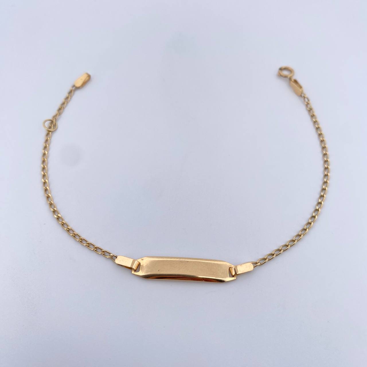 Pulso Bebe Espiga 1.25gr / 15.5cm / 1.2mm Placa Rectangular Ovalada Lisa Oro Amarillo +3 18K $