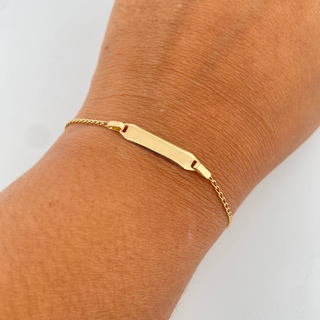 Pulso Bebe Espiga 1.25gr / 15.5cm / 1.2mm Placa Rectangular Ovalada Lisa Oro Amarillo +3 18K $