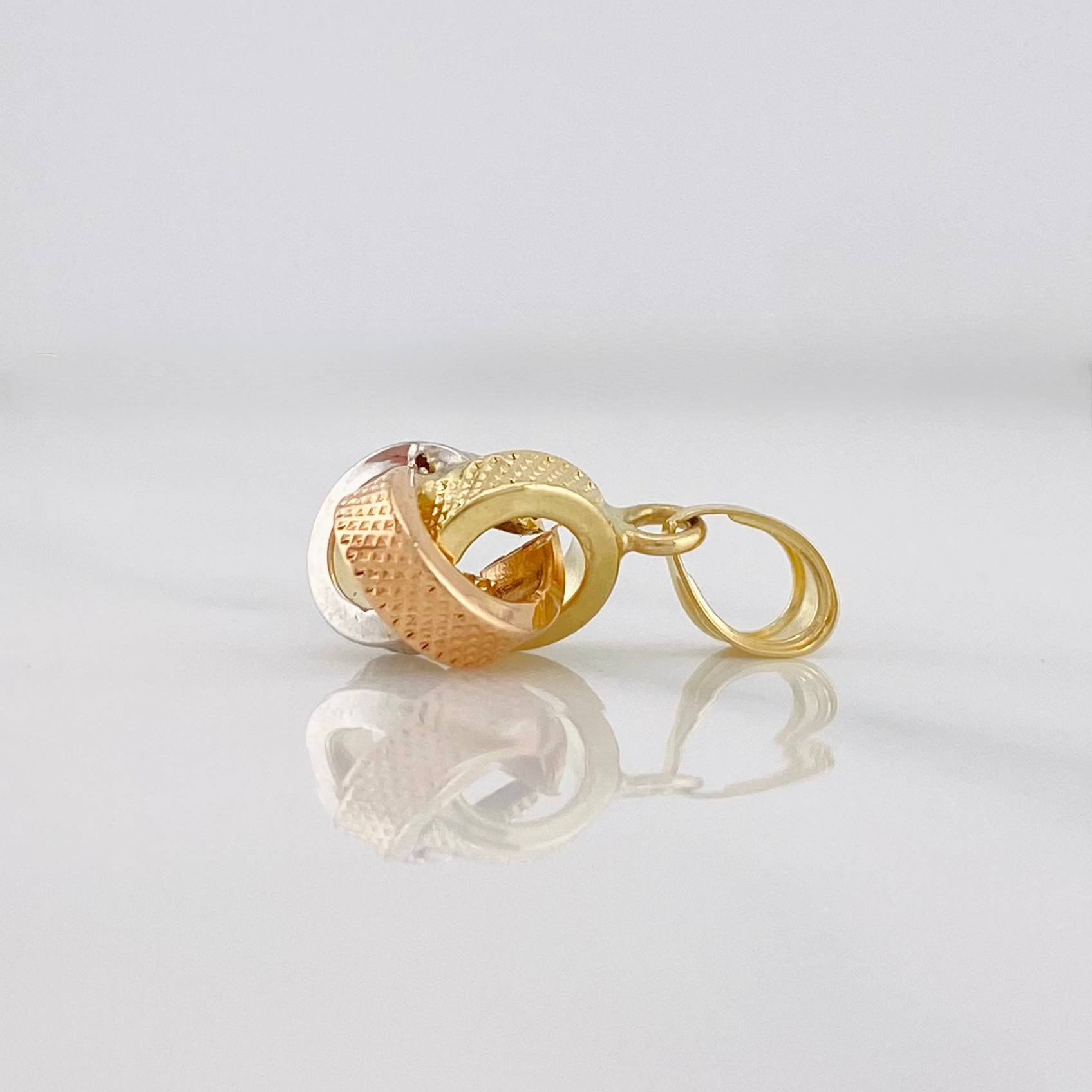 Dije Nudo 0.55g / 1.5cm Tres Oros 18K