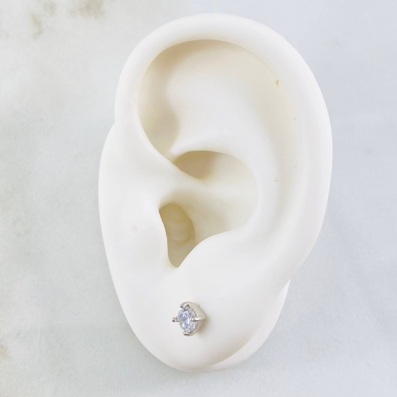 Topos Bisel 0.85gr / Oro Blanco 18K