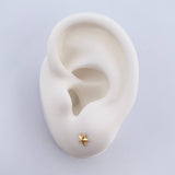 Topos Estrella 0.45gr / Troquelado Oro Amarillo 18K $