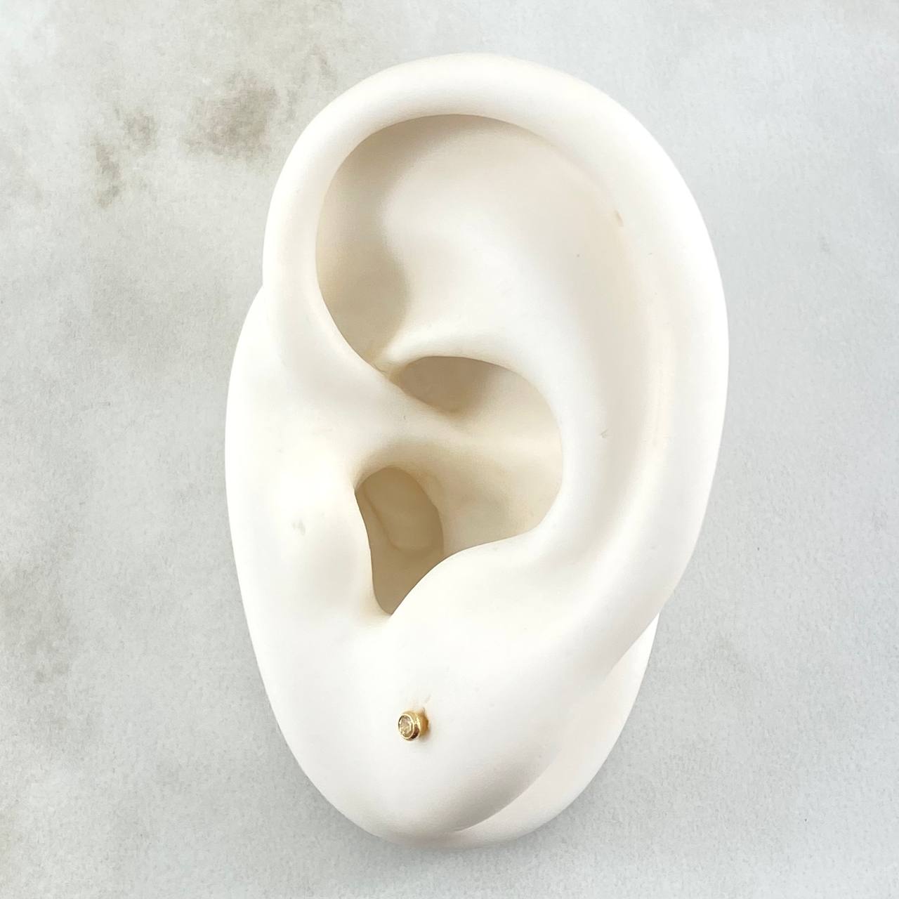 Topos Bisel 0.35gr / 2mm Oro Amarillo 18K ©