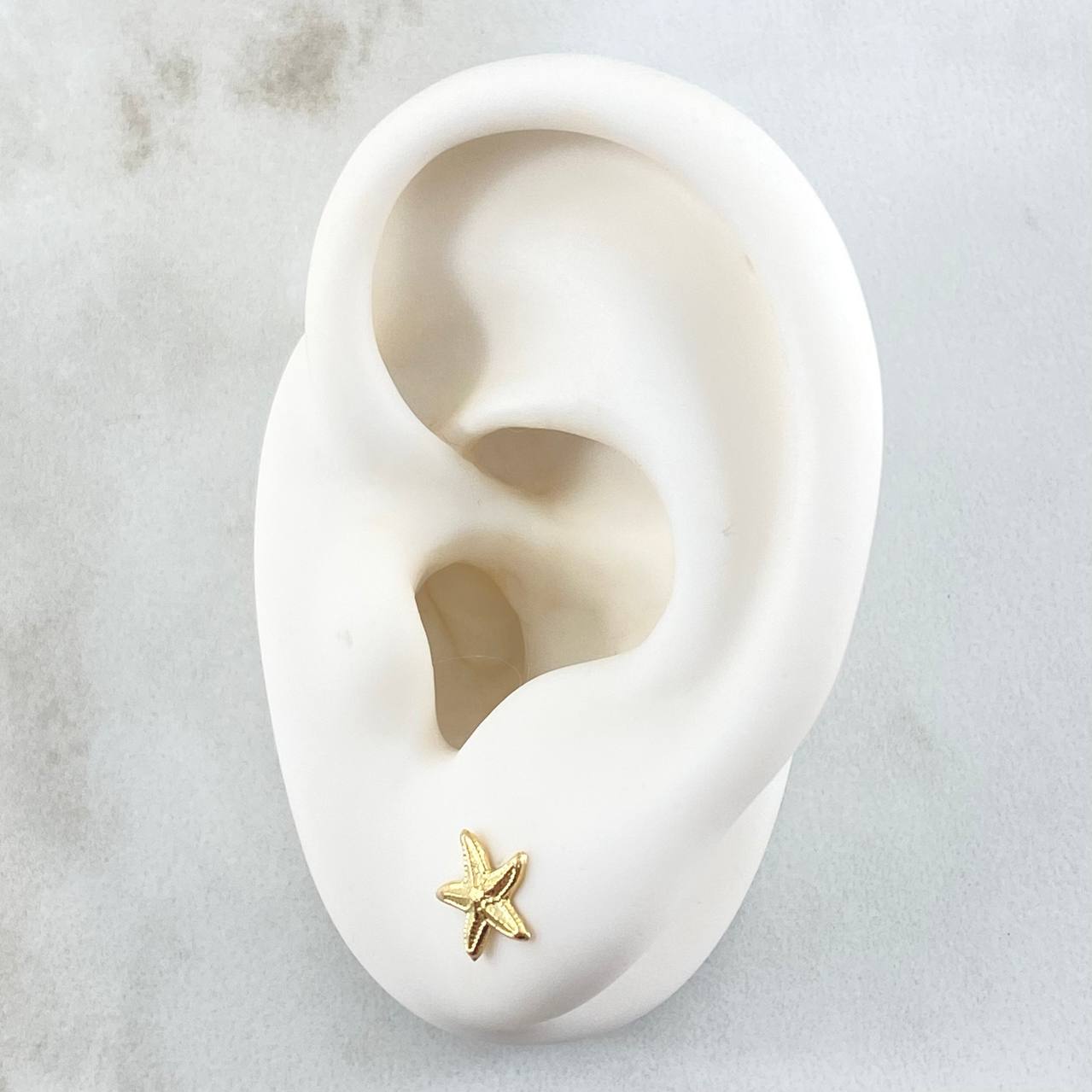 Topos Estrella De Mar 0.55gr / 7.4mm Oro Amarillo 18K *