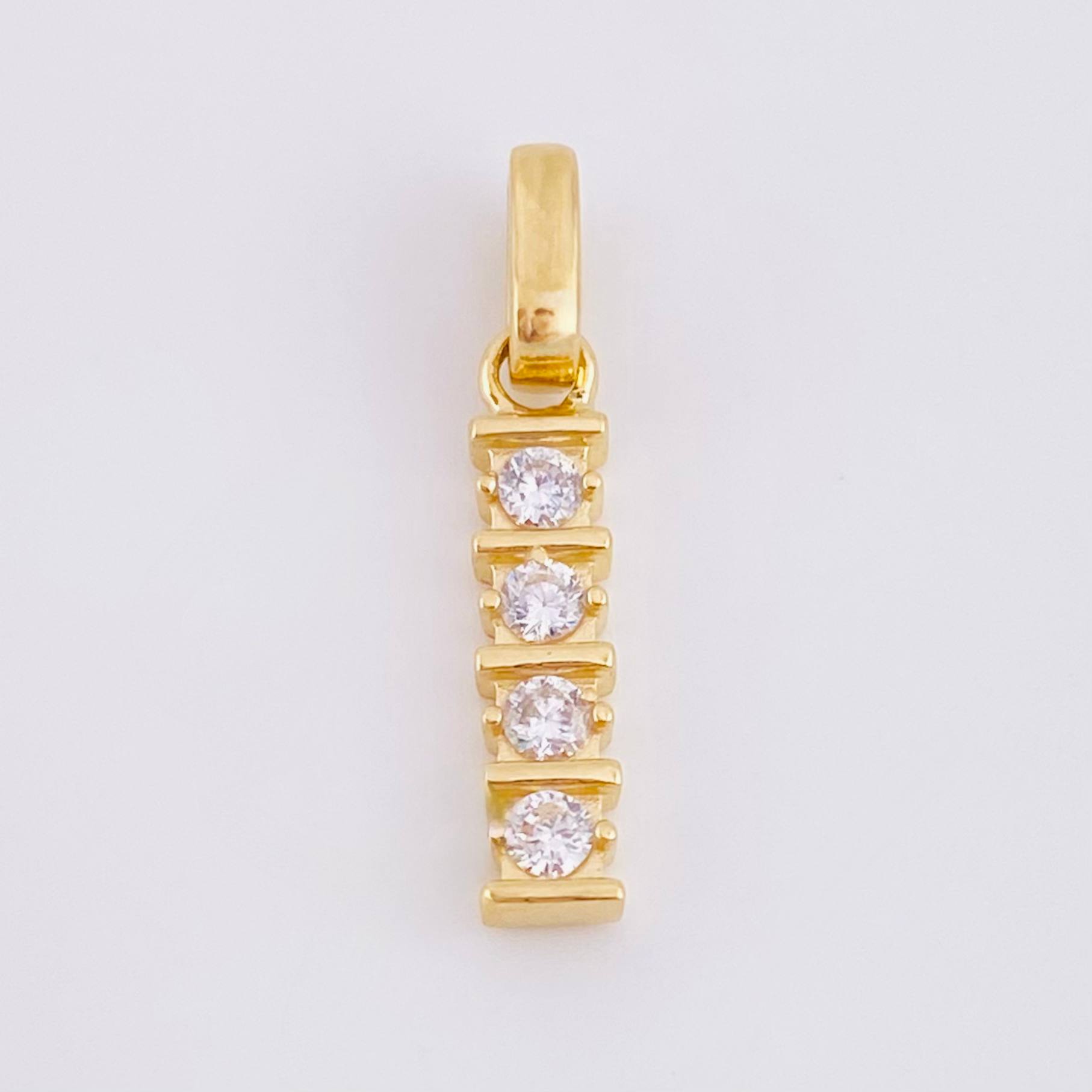 Dije Fila Intersecta 1.2gr / 2.3cm / Oro Amarillo 18K *