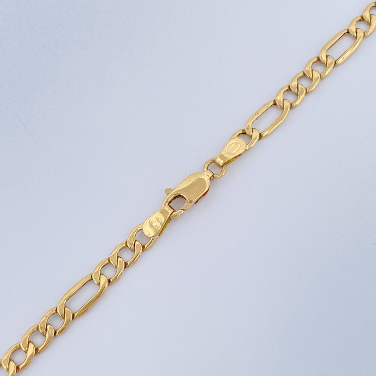 Cadena Figaro 6.45gr / 50.5cm / +1 Oro 18K $