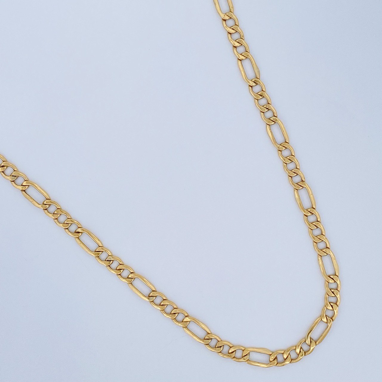 Cadena Figaro 6.45gr / 50.5cm / +1 Oro 18K $