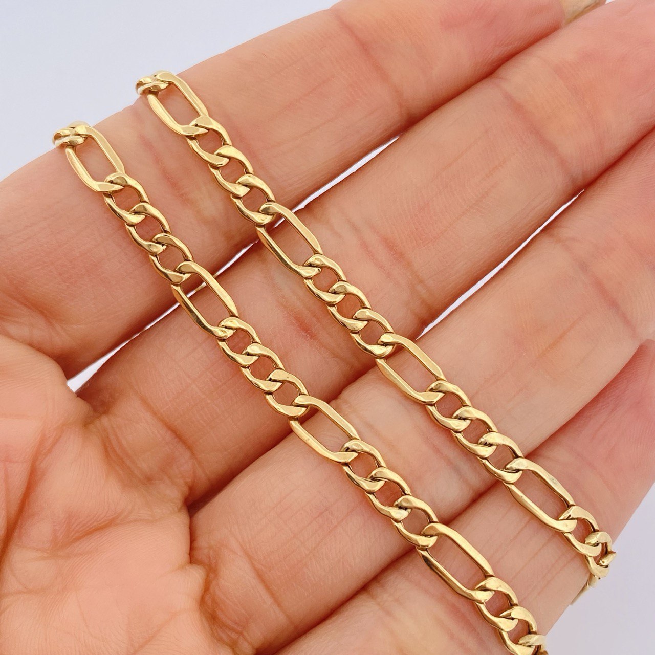 Cadena Figaro 6.45gr / 50.5cm / +1 Oro 18K $