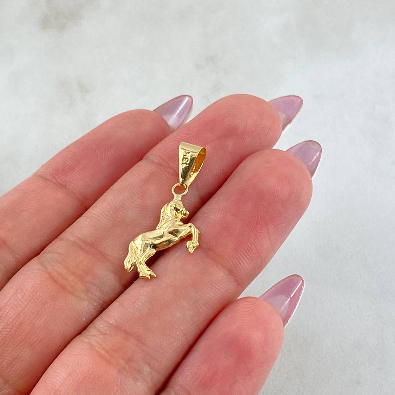 Dije Caballo 0.65gr / 2.5cm / Oro Amarillo 18K