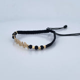 Pulsera Negra Mamá 1.5gr / Oro 18K $