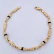 Pulso Rustico Duabi 4.7gr / 21.1cm / 4mm Cauchos Negros Oro Amarillo 18K $