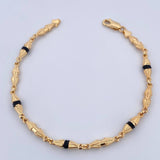 Pulso Rustico Duabi 4.7gr / 21.1cm / 4mm Cauchos Negros Oro Amarillo 18K $