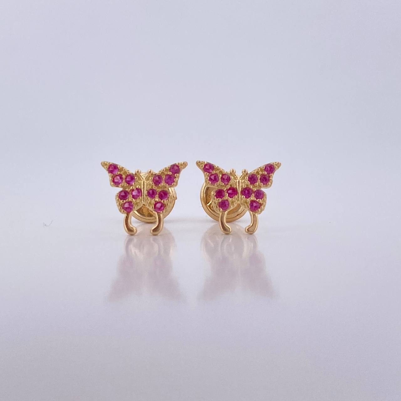 Topos Mariposa 0.85gr / Circones Fucsias Oro Amarillo 18K $