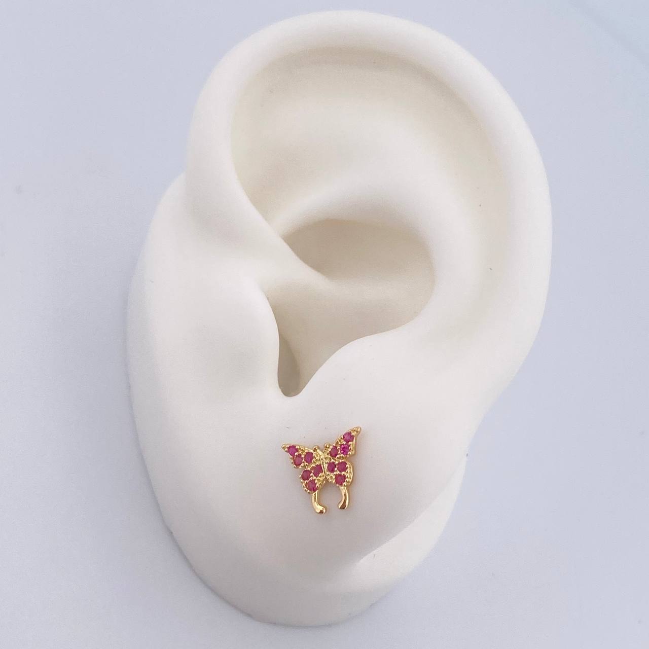 Topos Mariposa 0.85gr / Circones Fucsias Oro Amarillo 18K $