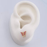 Topos Mariposa 0.85gr / Circones Fucsias Oro Amarillo 18K $
