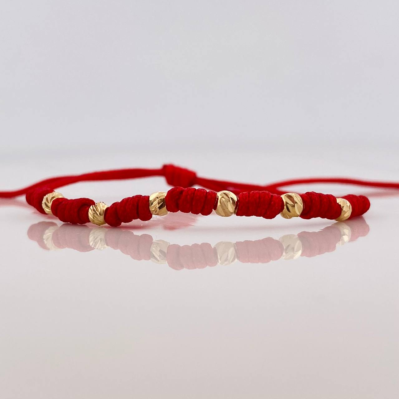 Pulsera Tejida Roja Siete Nudos Oro Amarillo 18K